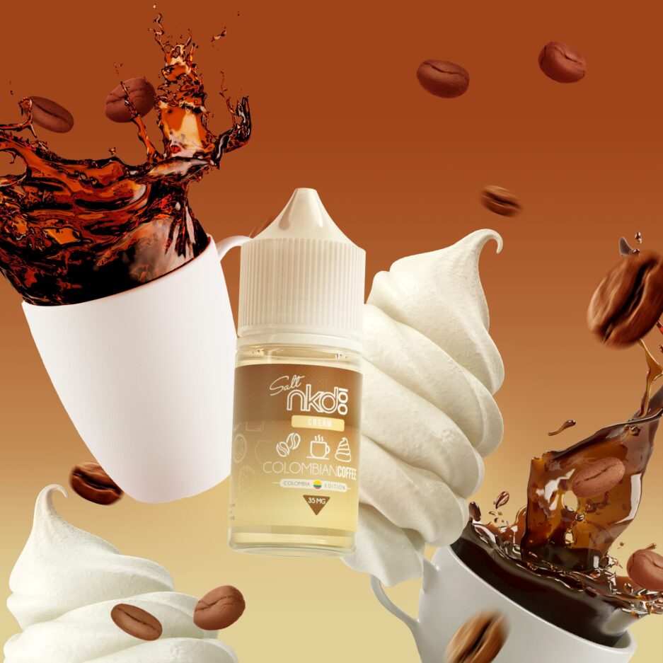 Colombian coffee is flying in the air with coffee beans dispersed around the image with two cups of coffee splashing in the air on each side with a dollop of cream next to the bottle, exemplifying the immense flavor this product holds.