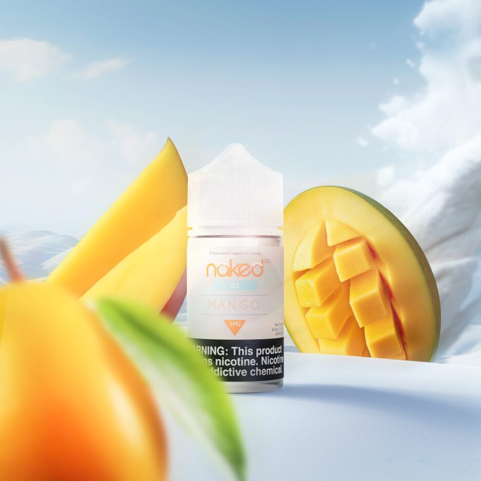 Naked100 internationals Mango Ice is standing at the center of a snowy hill, with snowy mountains and a clear sky in the background and a landslide of snow coming in from the right, Mangos are on the sides of the bottle and one in the foreground.