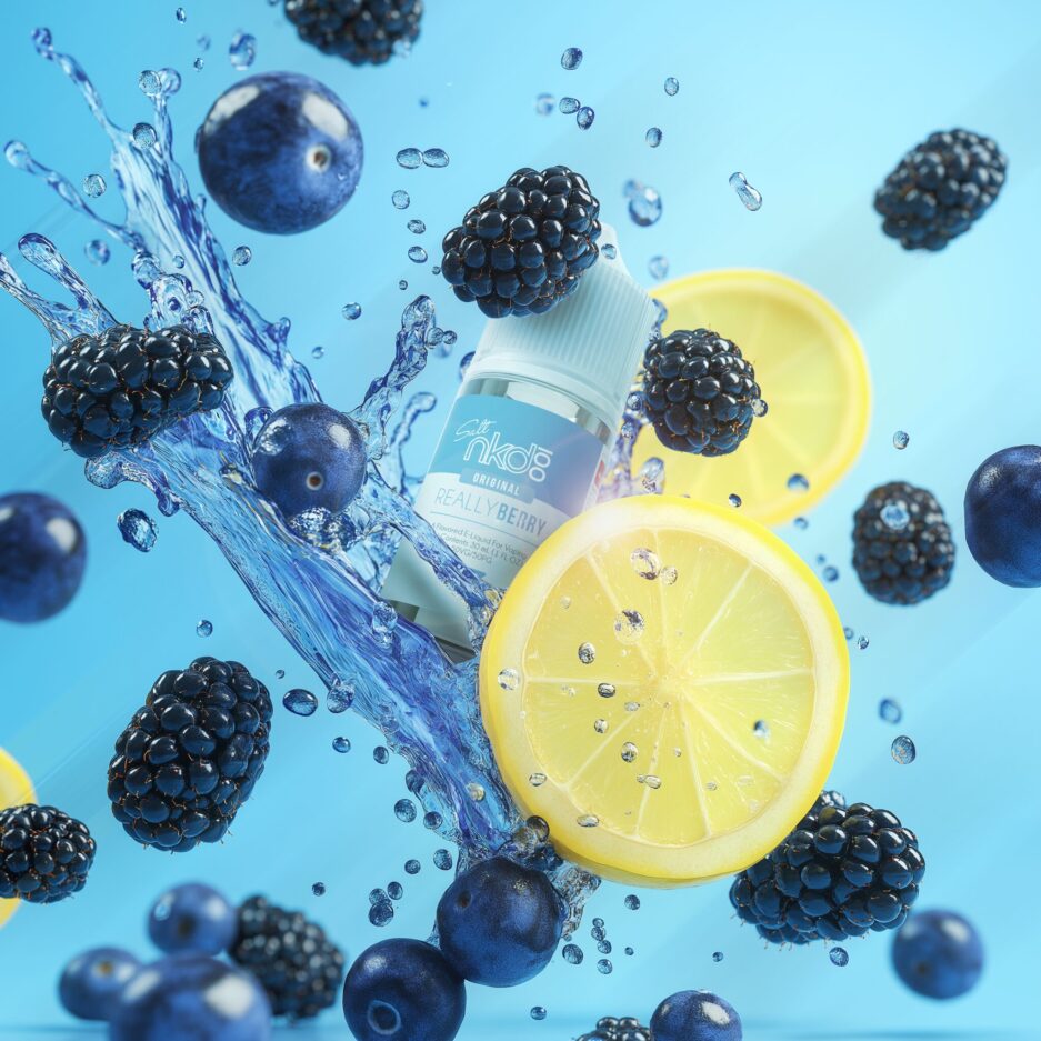 Really Berry is flying in between a splash of blue liquid, blueberries, lemons, and blackberries all floating in the air with a seamless blue background.