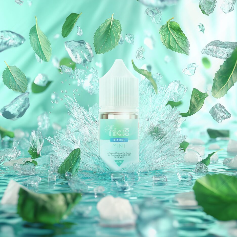 Naked100 Salt Mint is center splashing into a floor of water and ice, ice and mint leaves fly in the air with pieces floating on the water, in a bright white and blue color tone setting.