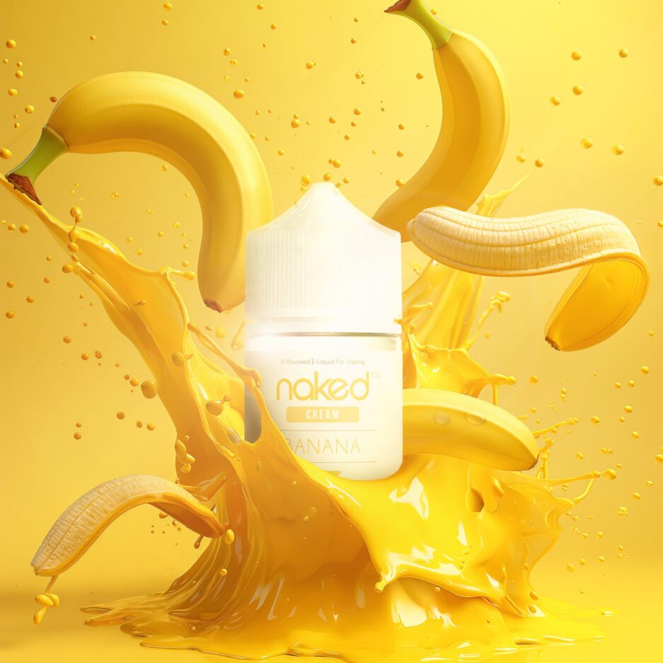 A product shot with yellow matte floors and seamless background, One big splash of yellow liquid with banana peels and bananas flying outwards, with Naked100's Banana 60mL bottle in the center of the image sitting in the center of it all.