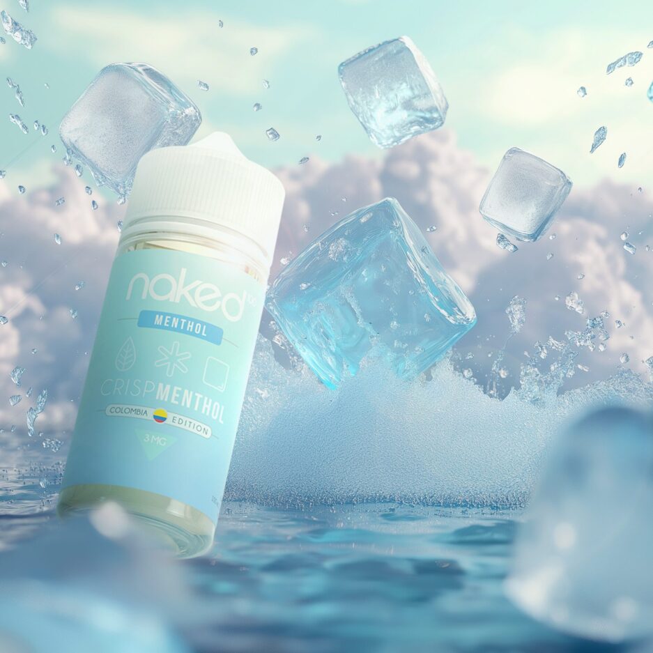 A product shot with the ocean as the floor, cool skies in the background with a big splash at the center of the image coming from giant ice cubes falling into the water that are dispersed throughout the image. Naked100 Colombia's Crisp Menthol is at the left side of the image falling into the water as well.