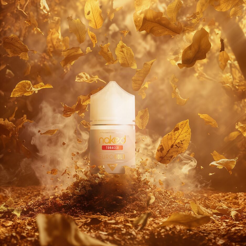 A product shot set in a gold and neutral color palate landscape, with Naked100's international line Euro Gold 60mL bottle sitting on a pile of yellow tobacco leafs. Smoke peaks through the floor and surrounds the bottle, giving the viewer a sense of what Euro Gold stands for.