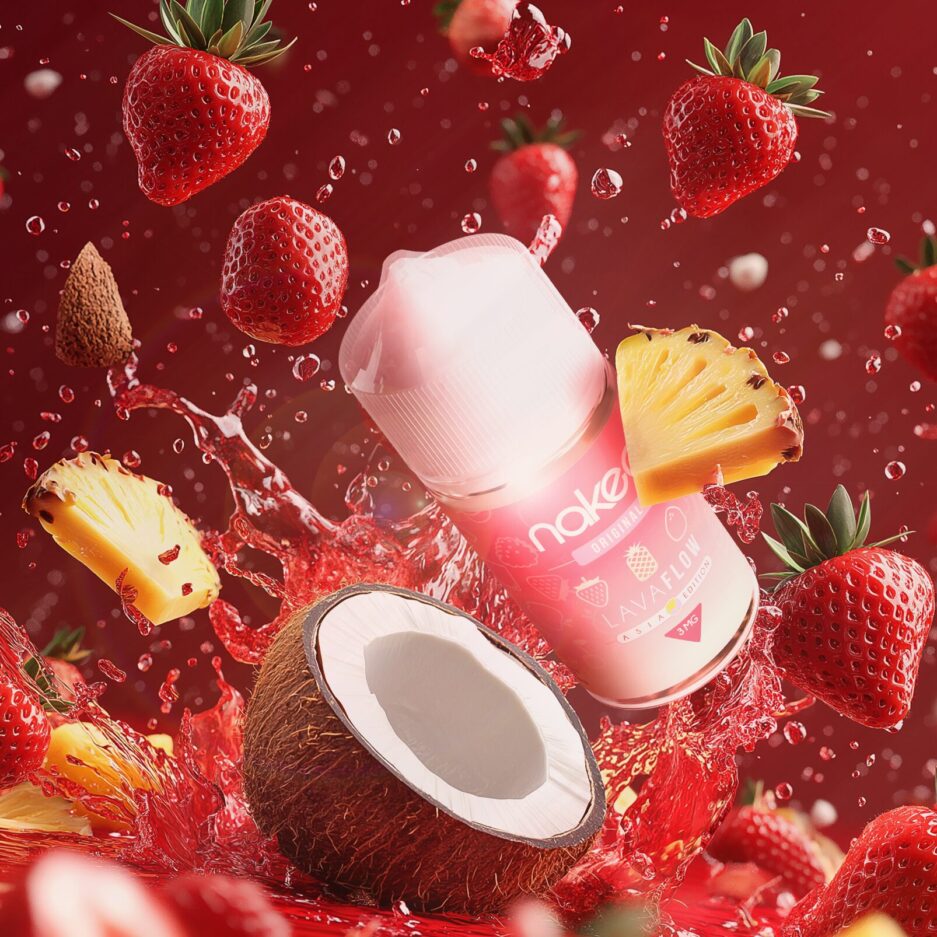 A product shot with red color tones and a sea of red juice on the lower part of the image, coconutss, pineapple slices, and strawberries all faling and splashing into the juice with Naked100's Asia Lava Flow in the center also heading for the juice, exemplifying the juiciness and flavor that the product has.