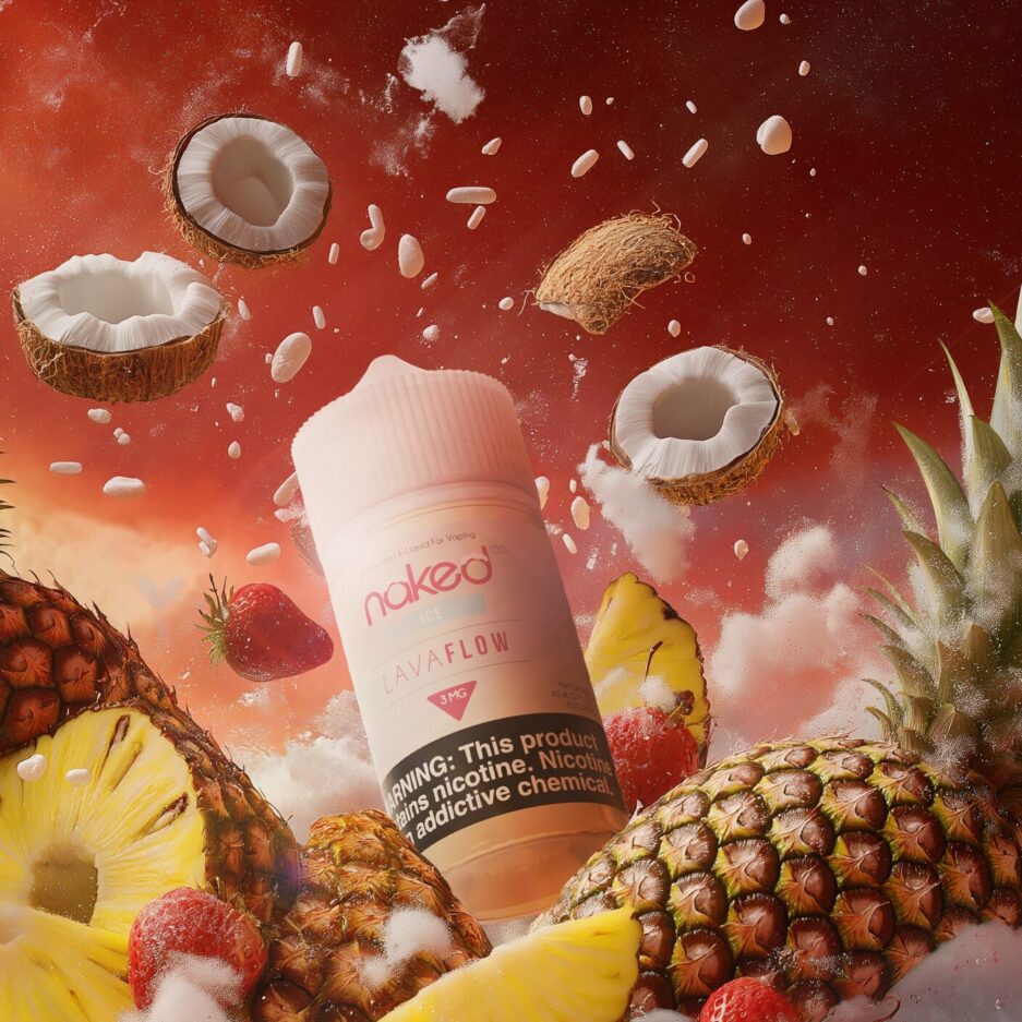 A product photo set in a icy landscape withe a snowy floor and red cloudy sky, pineapples and strawberries are piled in the foreground with Naked100's Lava Flow Ice in the center behind the fruits, while coconuts and pieces of snow are flying in the background.