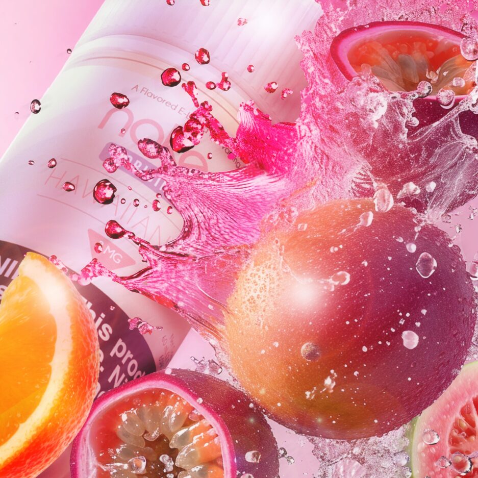 A tight product shot with pink color tones, Passion fruits, oranges, and guavas mixed with a pink liquid splash form the right onto Naked100's Hawaiian POG.