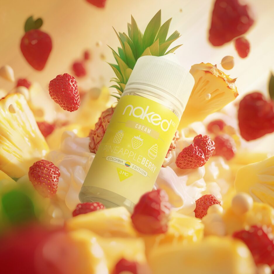 A product shot with a pile of cream at the center, and pineapples and strawberries all around the sides and in the foreground all guiding the viewers eye towards the center where Naked100 Colombias Pineapple Berry is falling into the cream.