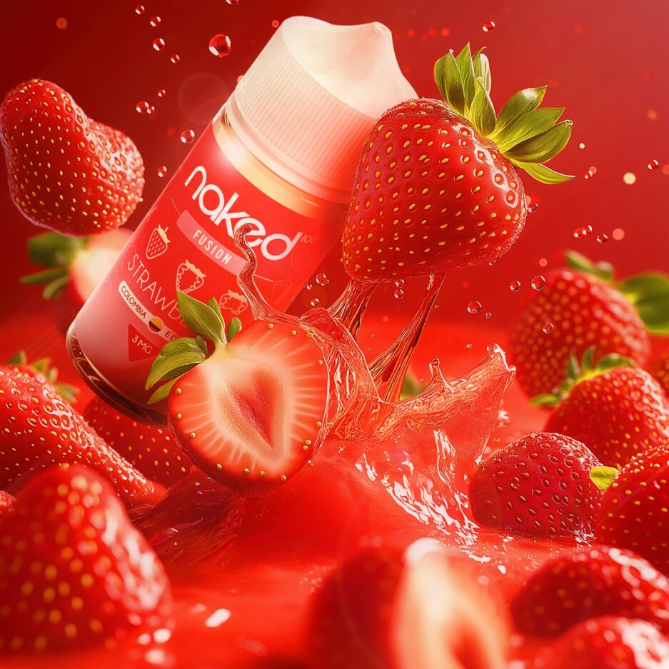 A tight product shot with enlarged strawberries splashing into a juicy red liquid. Naked100 Colombia's Strawberry Fusion is falling as well into the liquid mixing between the strawberries.